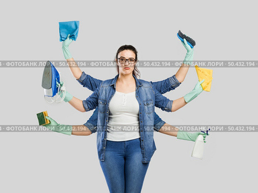 Creative concepts of a housewife with six armr. Стоковое фото, агентство Ingram Publishing / Фотобанк Лори