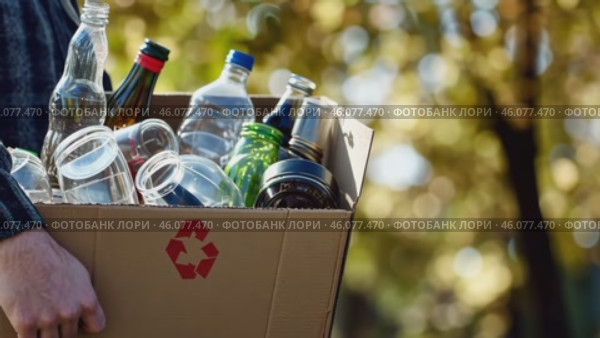 Cropped unrecognized person carrying crate of empty plastic bottles. Recycling plastic concept. Hands with Recycle Bin. Littering of environment. Problem of global plastics pollution of the Earth. Стоковое AI-видео, аниматор Марина Демидюк / Фотобанк Лори