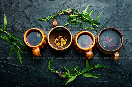 Cup of herbal tea on the table. Ivan tea or fireweed.Willow-herb. Therapeutic fireweed tea,fresh willow herb. Стоковое фото, агентство Ingram Publishing / Фотобанк Лори
