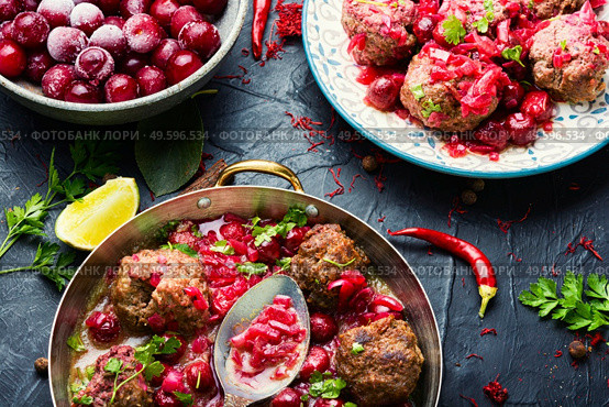Delicious kufta or lamb meatballs in cherry sauce. Kufta in cherry sauce. Стоковое фото, агентство Ingram Publishing / Фотобанк Лори