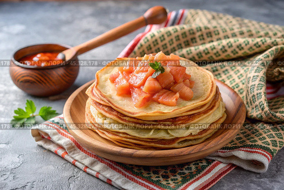 Delicious pancakes with salted red fish. The concept of the Russian holiday Maslenitsa. Стоковое AI-изображение, AI-художник Photojuli / Фотобанк Лори