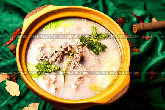 Delicious Savory Mutton Stew Presented in a Traditional Chinese Serving Pot. Стоковое фото, фотограф Aleksandr Golubev / Фотобанк Лори