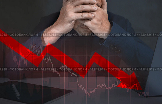 Depressed business man looking down at falling red arrow. desperate about losing money of crisis, recession, inflation. Стоковое фото, фотограф Павел Муравьев / Фотобанк Лори