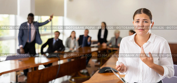 Devastated millennial white brunette female worker being fired. Стоковое фото, фотограф Яков Филимонов / Фотобанк Лори