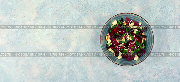 Dietary salad of beetroot, cheese, prunes and nuts. Copy space, recipe place.. Salad with boiled beetroot and nuts, space for text. Стоковое фото, агентство Ingram Publishing / Фотобанк Лори