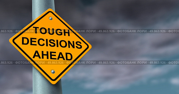 Difficult and tough decisions business journey symbol of uncertainty in a challenging financial situation and preparing for difficult solutions to problems as a yellow traffic sign on a stormy cloud background. Стоковое фото, агентство Ingram Publishing / Фотобанк Лори