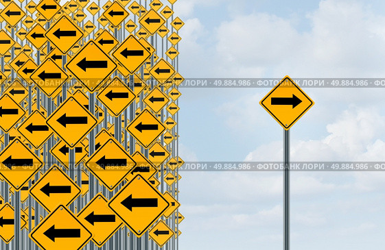Direction individuality and independent thinking concept as a group of directional arrow traffic signs with one individual pointing in the opposite way as a business icon for innovative solution. Стоковое фото, агентство Ingram Publishing / Фотобанк Лори