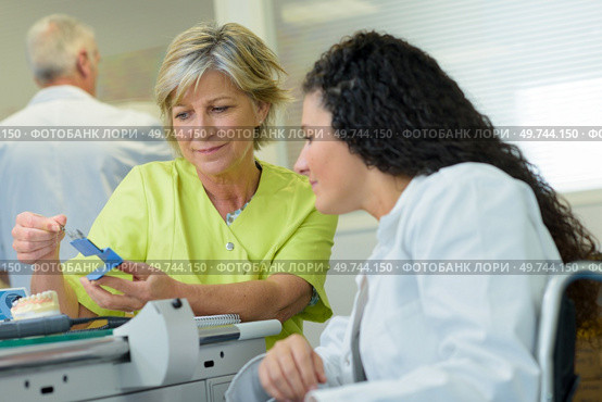 disabled woman training to work in prosthetics laboratory. Стоковое фото, агентство Ingram Publishing / Фотобанк Лори