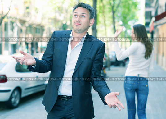 Disappointed man in quarrel with girlfriend. Стоковое фото, фотограф Яков Филимонов / Фотобанк Лори