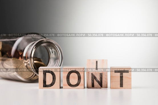 dont word with jar with coins. Стоковое фото, агентство Ingram Publishing / Фотобанк Лори