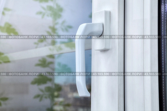 Double hung white vinyl window made of aluminum profile and plastic, with double glazing and mosquito net. Стоковое фото, фотограф Владимир Григорьев / Фотобанк Лори