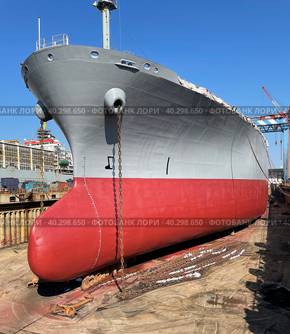 Dry-cargo ship in dry dock for repairs and maintenance at a shipyard. Стоковое фото, фотограф Ирина Старикова / Фотобанк Лори