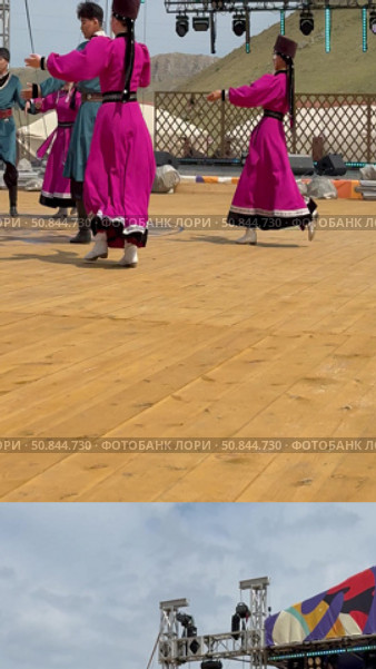 ELANTSY, IRKUTSK REGION, RUSSIA - July 5, 2025: Erdyn Games - festival of nomadic peoples of Eurasia. Vertical video of group of Buryat youths and girls in national costumes dancing fiery folk dance on open stage. Редакционное видео, видеограф Виктория Катьянова / Фотобанк Лори