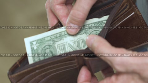 Elderly Man With Empty Wallet Counting Single Dollar. Стоковое видео, видеограф Владимир Федоров / Фотобанк Лори