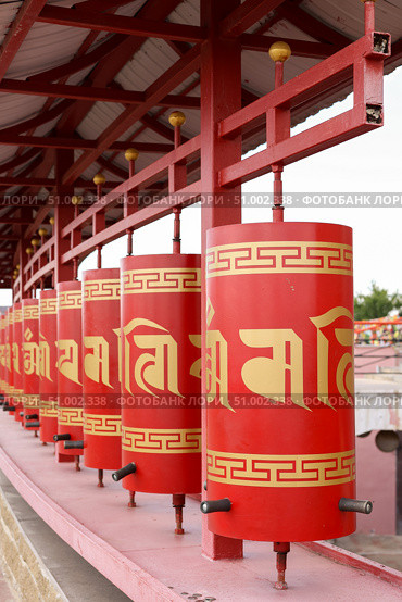 Elista, capital of Republic of Kalmykia, Russia, July, 4, 2025: Prayer drums of khurul, Buddhist temple Golden Abode of Buddha Shakyamuni, largest Buddhist temple in Europe. Редакционное фото, фотограф Екатерина Топорова / Фотобанк Лори
