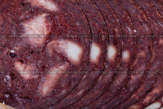 European cuisine blood pudding on white plate on wooden table. Стоковое фото, фотограф Яков Филимонов / Фотобанк Лори