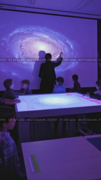 Exploring the Wonders of the Universe: Children Engaged in a Cosmic Learning Experience with an Interactive Galaxy Projection. Стоковое AI-видео, аниматор Владимир Федоров / Фотобанк Лори