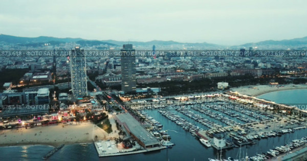 Famous Barceloneta beach on Mediterranean in Barcelona in night lights (2018 год). Стоковое видео, видеограф Яков Филимонов / Фотобанк Лори