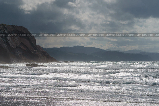 Fantastic picturesque seascape of Itzurun beach in Zumaia in Basque Autonomous Community  country in summer day. Concept of the beauty in nature. Noise of the ocean in the image. Стоковое фото, фотограф YuryKara / Фотобанк Лори