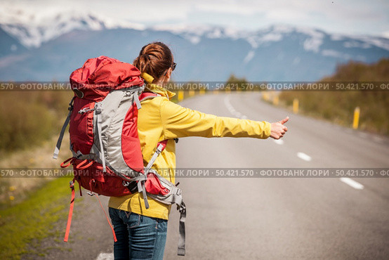 Female backpacker tourist in Icleand ready for adventure . Стоковое фото, агентство Ingram Publishing / Фотобанк Лори