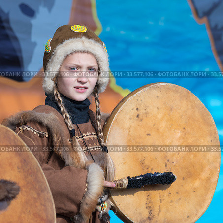 Female child dancing with tambourine in tradition clothing indigenous inhabitants Kamchatka Peninsula. Celebration Koryak national holiday Day of Seal - Hololo (2018 год). Редакционное фото, фотограф А. А. Пирагис / Фотобанк Лори