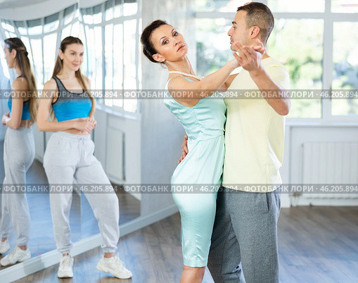 Female dance teacher performing waltz with male student. Стоковое фото, фотограф Яков Филимонов / Фотобанк Лори