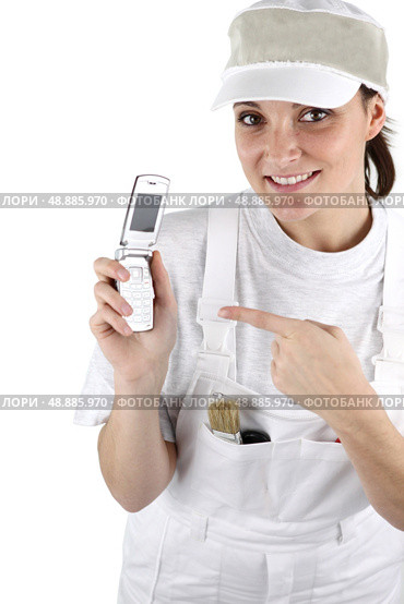 Female decorator waiting for the phone to ring. Стоковое фото, агентство Ingram Publishing / Фотобанк Лори