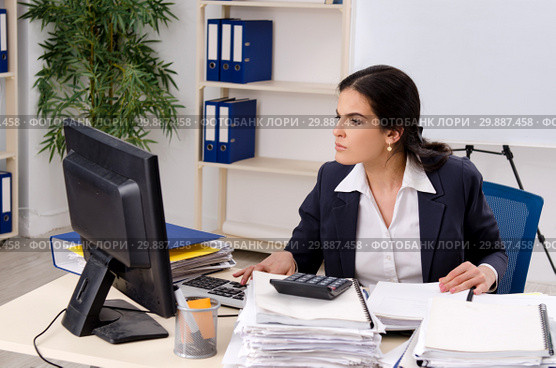 Female employee with too much work in the office. Стоковое фото, фотограф Elnur / Фотобанк Лори