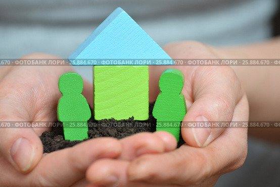 Female hands holding a piece of land with wooden house. Ecological home, family, construction and real estate concept. Стоковое фото, фотограф Сергей Дорошенко / Фотобанк Лори