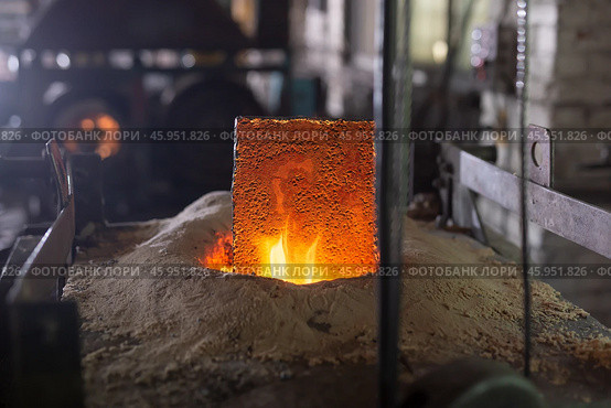 Ferrous metal billet is melted in an induction furnace closeup. Стоковое фото, фотограф Татьяна Яцевич / Фотобанк Лори