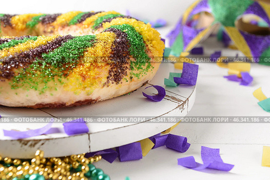 Festive cake for Mardi Gras (Fat Tuesday) holiday on white table. Стоковое фото, фотограф Pixel_shot / Фотобанк Лори