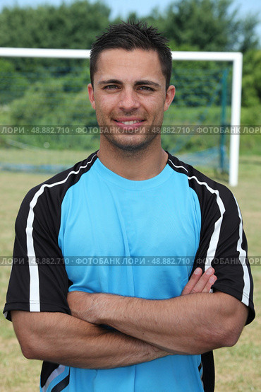 Football player stood on pitch. Стоковое фото, агентство Ingram Publishing / Фотобанк Лори