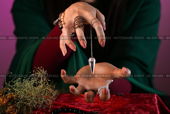 Fortune teller reading future at table. Стоковое фото, фотограф Pixel_shot / Фотобанк Лори