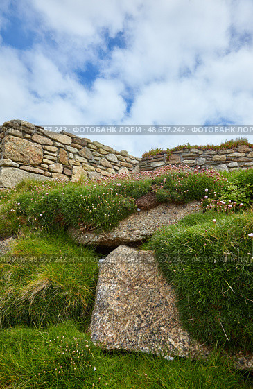 Fragment of stonework against blue sky. Land’s end. Cornwall. England. GB. (2009 год). Стоковое фото, фотограф Сергей Пристяжнюк (Serg Zastavkin) / Фотобанк Лори