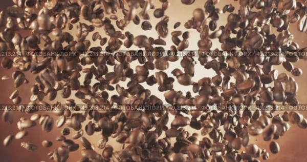 Fragrant coffee beans soar in the frame. Coffee beans shot on super slow motion camera 1000 fps. Стоковое видео, видеограф Андрей Армягов / Фотобанк Лори