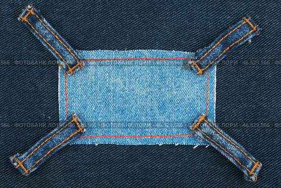 Frame made of denim with four straps of jeans, lies on the dark denim, Стоковое фото, фотограф Александр Собко / Фотобанк Лори