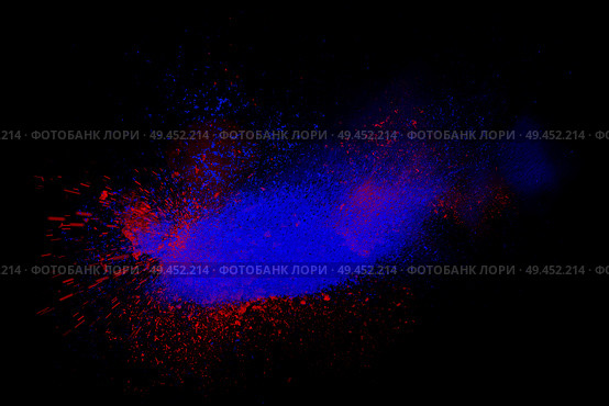 Freeze motion of red and blue powder exploding, isolated on black, dark background. Abstract design of dust cloud. Particles explosion, screen saver wallpaper with copy space. Vivid colorful ash. Стоковое фото, агентство Ingram Publishing / Фотобанк Лори