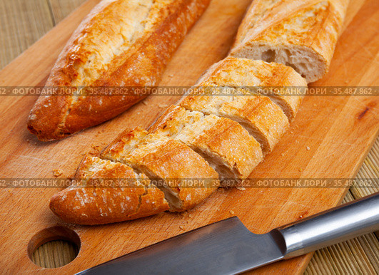 French loaves with chopped slices. Стоковое фото, фотограф Яков Филимонов / Фотобанк Лори