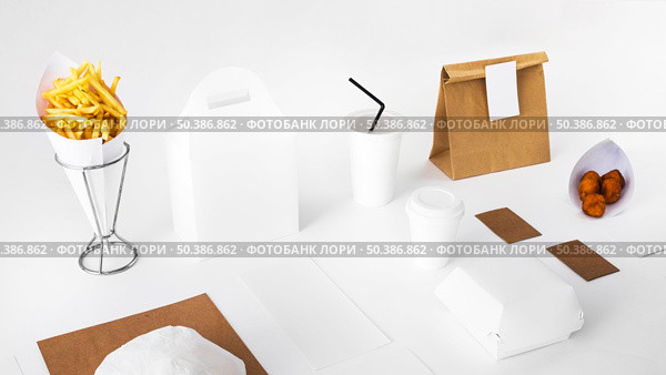 fried food with packed food disposal cup white backdrop. Стоковое фото, агентство Ingram Publishing / Фотобанк Лори