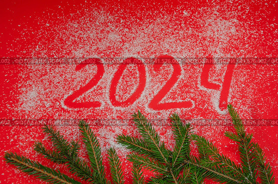 From the numbers 2024 on a red background with spruce branches, the concept of the New Year holiday. Стоковое фото, фотограф Елена Гломаздо / Фотобанк Лори