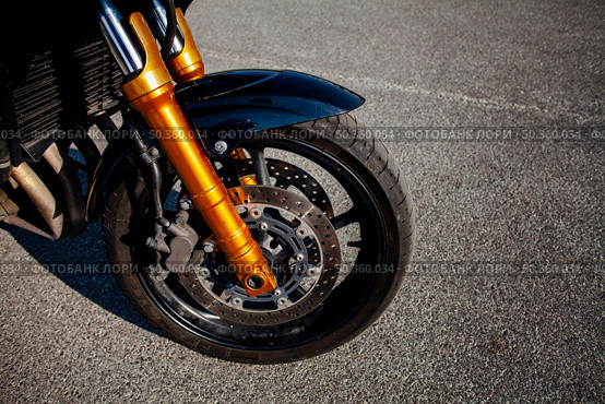 front tire orange motorbike. Стоковое фото, агентство Ingram Publishing / Фотобанк Лори
