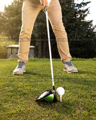 front view man practicing golf field. Стоковое фото, агентство Ingram Publishing / Фотобанк Лори