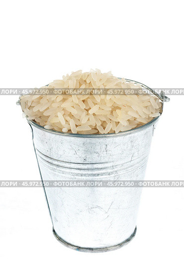 Full bucket of rice grains on a white background. Стоковое фото, фотограф Александр Собко / Фотобанк Лори