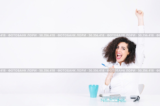 funny woman celebrating victory. Стоковое фото, агентство Ingram Publishing / Фотобанк Лори