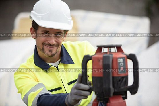 geometer at work construction foundation site. Стоковое фото, агентство Ingram Publishing / Фотобанк Лори