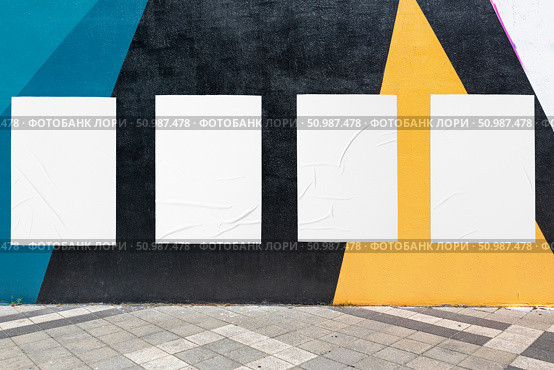 geometrical wall and four white glued wrinkled poster templates. Стоковое фото, фотограф Александра Конопля / Фотобанк Лори