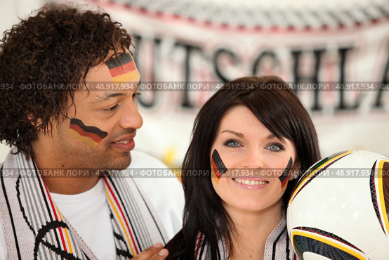 German man and woman ready to support their national team. Стоковое фото, агентство Ingram Publishing / Фотобанк Лори