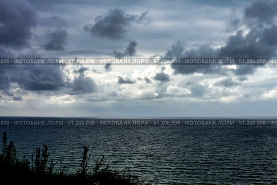 Gloomy Clouds Roll Over the Baltic Sea on a Moody Autumn Afternoon. Стоковое фото, фотограф Aleksandr Golubev / Фотобанк Лори