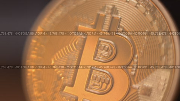 Gold Bitcoin Symbol beautifully placed on a Wooden Surface. Close up. Стоковое видео, видеограф Степанов Григорий / Фотобанк Лори