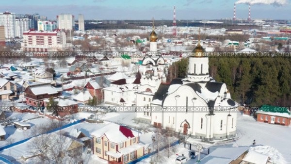 Город Сургут зимой. Храм Николая Чудотворца. Вид с воздуха. Surgut city in winter. The church in honor of St. Nicholas. Aerial view. (2022 год). Редакционное видео, видеограф Евгений Романов / Фотобанк Лори